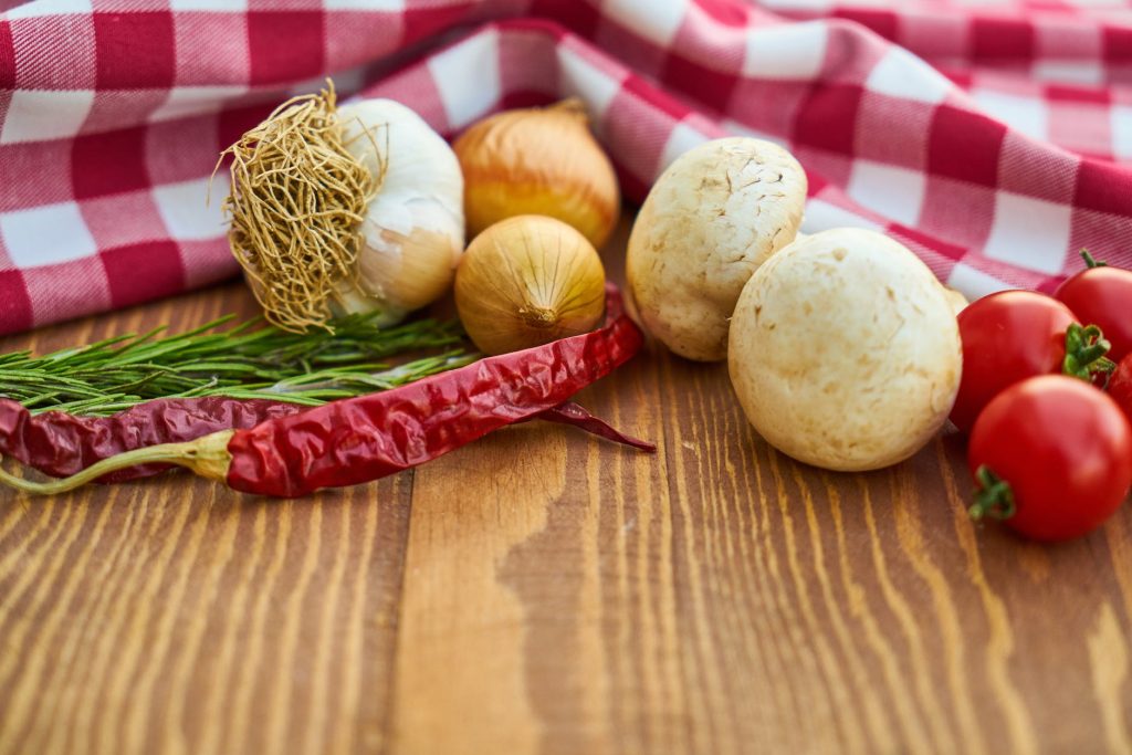 onions garlic and tomatoes close up photo