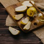 sliced pears beside a honey