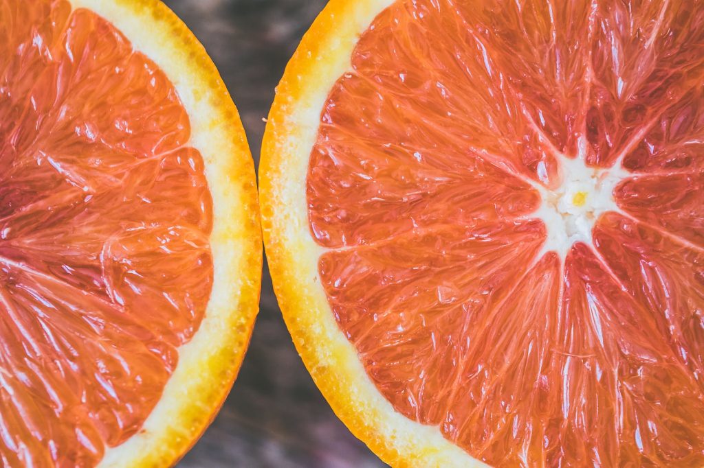 two sliced citrus fruits